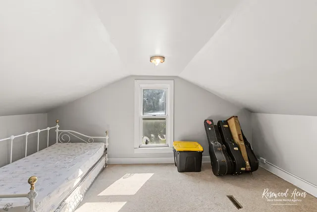 a bedroom with furniture and a window