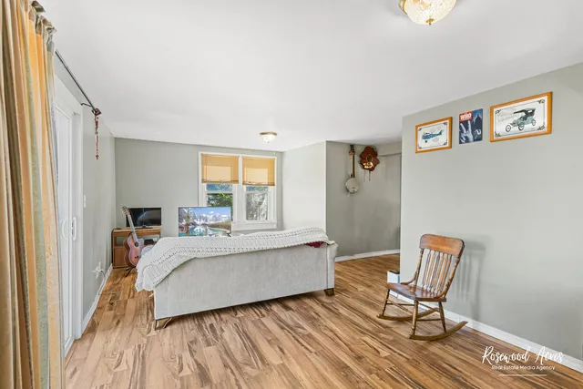 a bed room with a bed and a chair