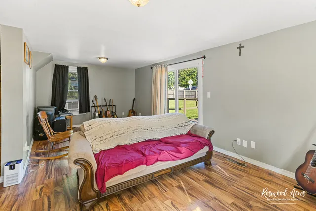 a bedroom with bed and window