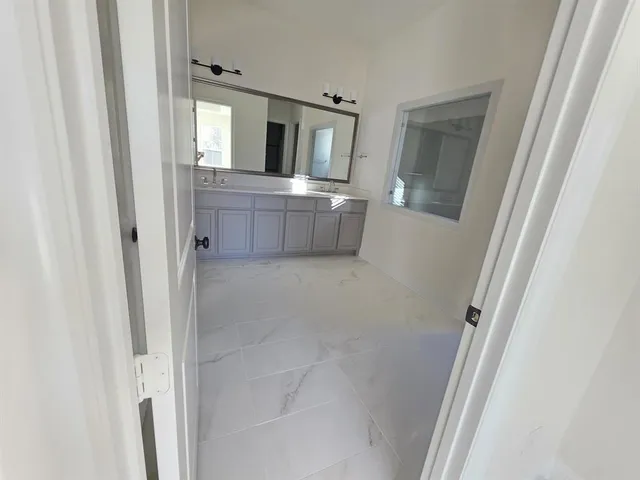 a view of empty room with windows