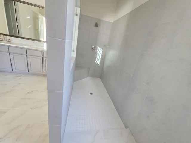 a bathroom with a sink and mirror