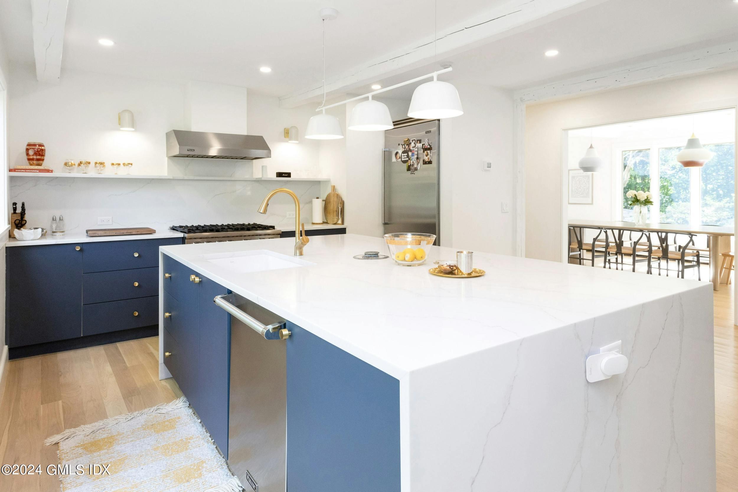 12 Guinea Road Greenwich, CT 06830 - Photo 13 of 38 a kitchen with kitchen island a sink appliances and a counter top space