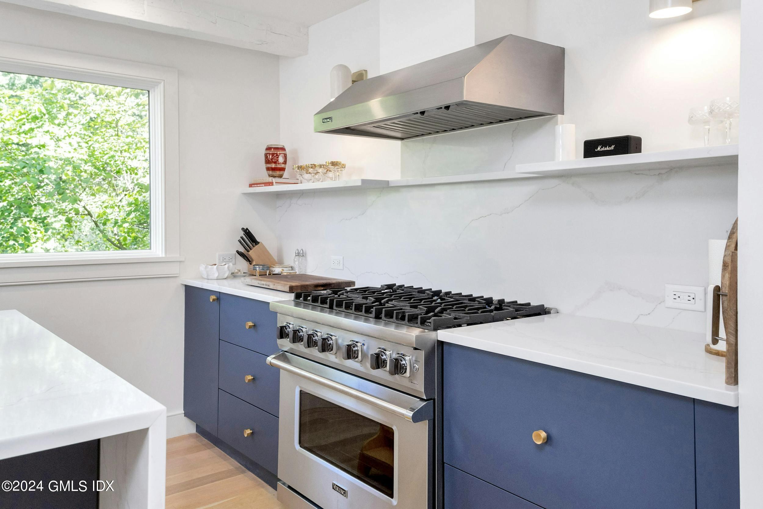 12 Guinea Road Greenwich, CT 06830 - Photo 14 of 38 a kitchen with stainless steel appliances a sink and a stove