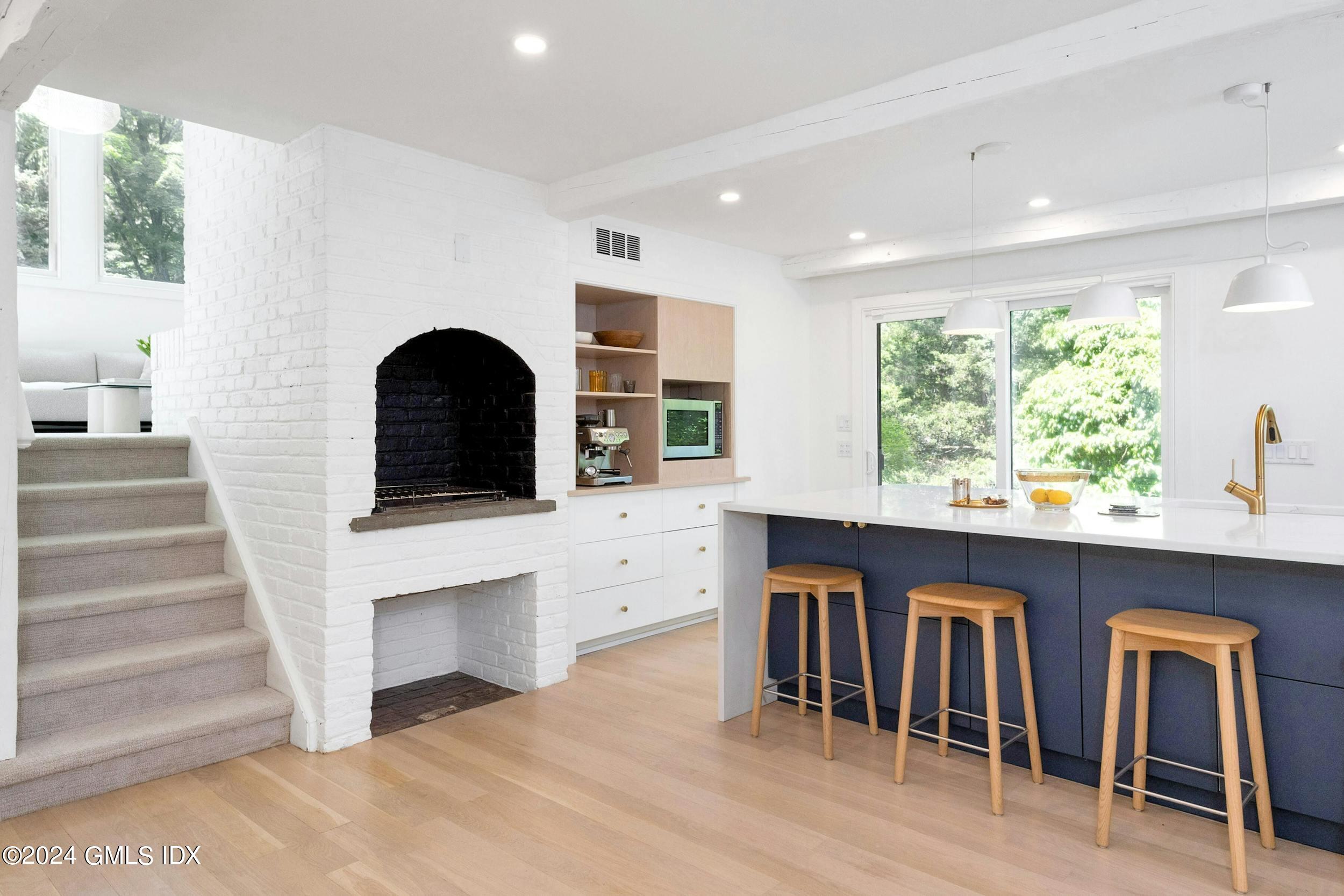 12 Guinea Road Greenwich, CT 06830 - Photo 15 of 38 a living room with furniture and a large window