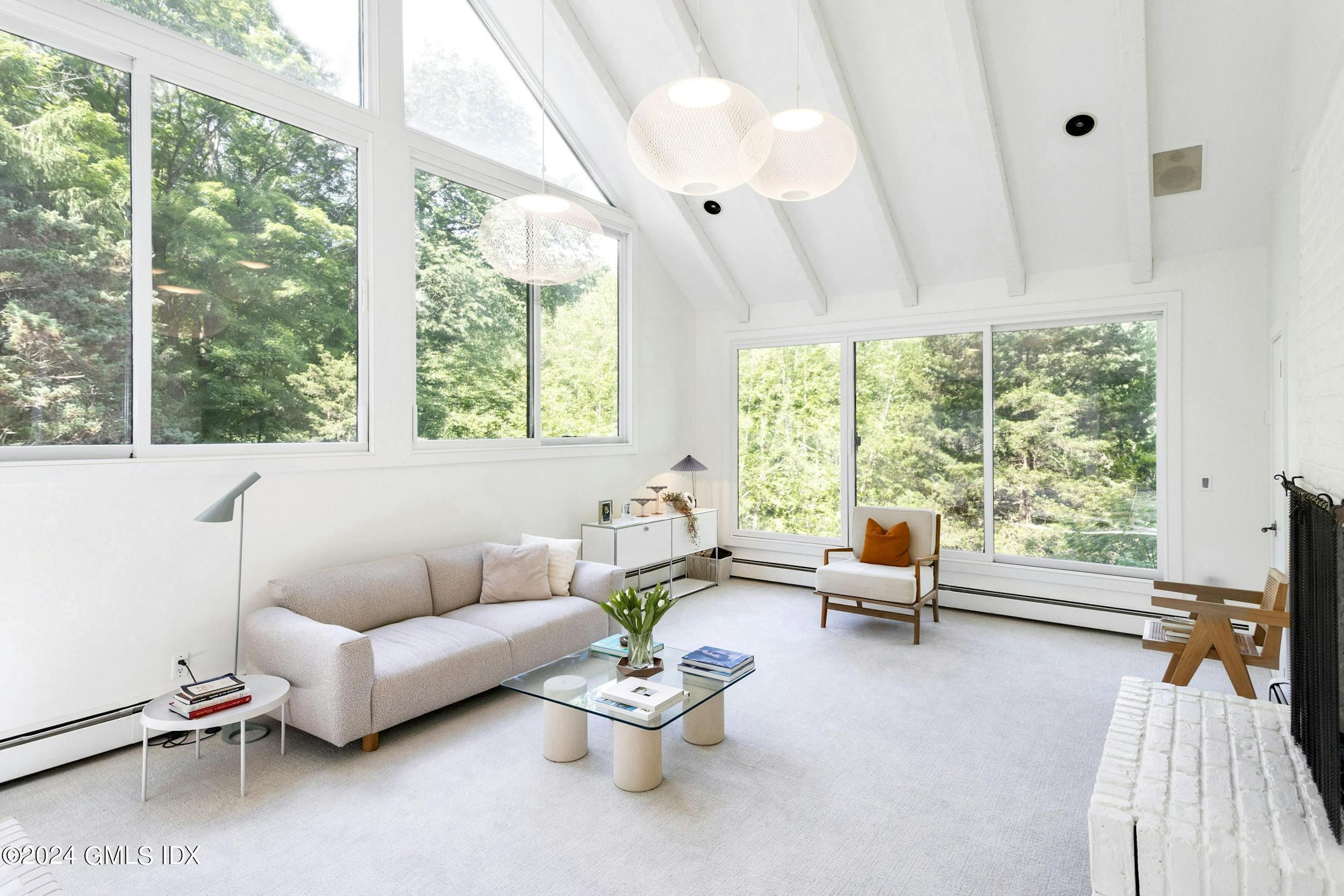12 Guinea Road Greenwich, CT 06830 - Photo 17 of 38 a living room with furniture and a large window