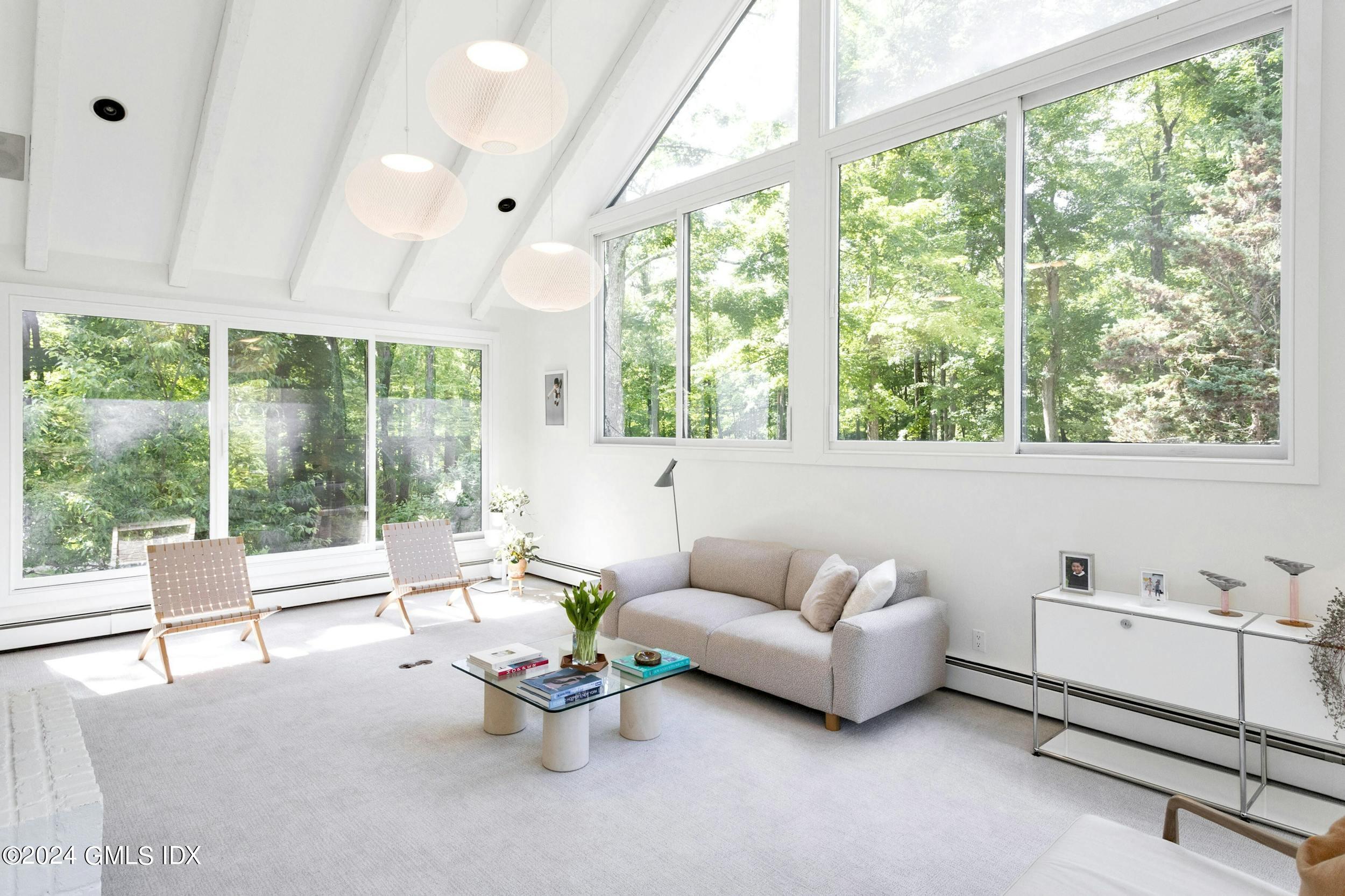 12 Guinea Road Greenwich, CT 06830 - Photo 18 of 38 a living room with furniture and a large window