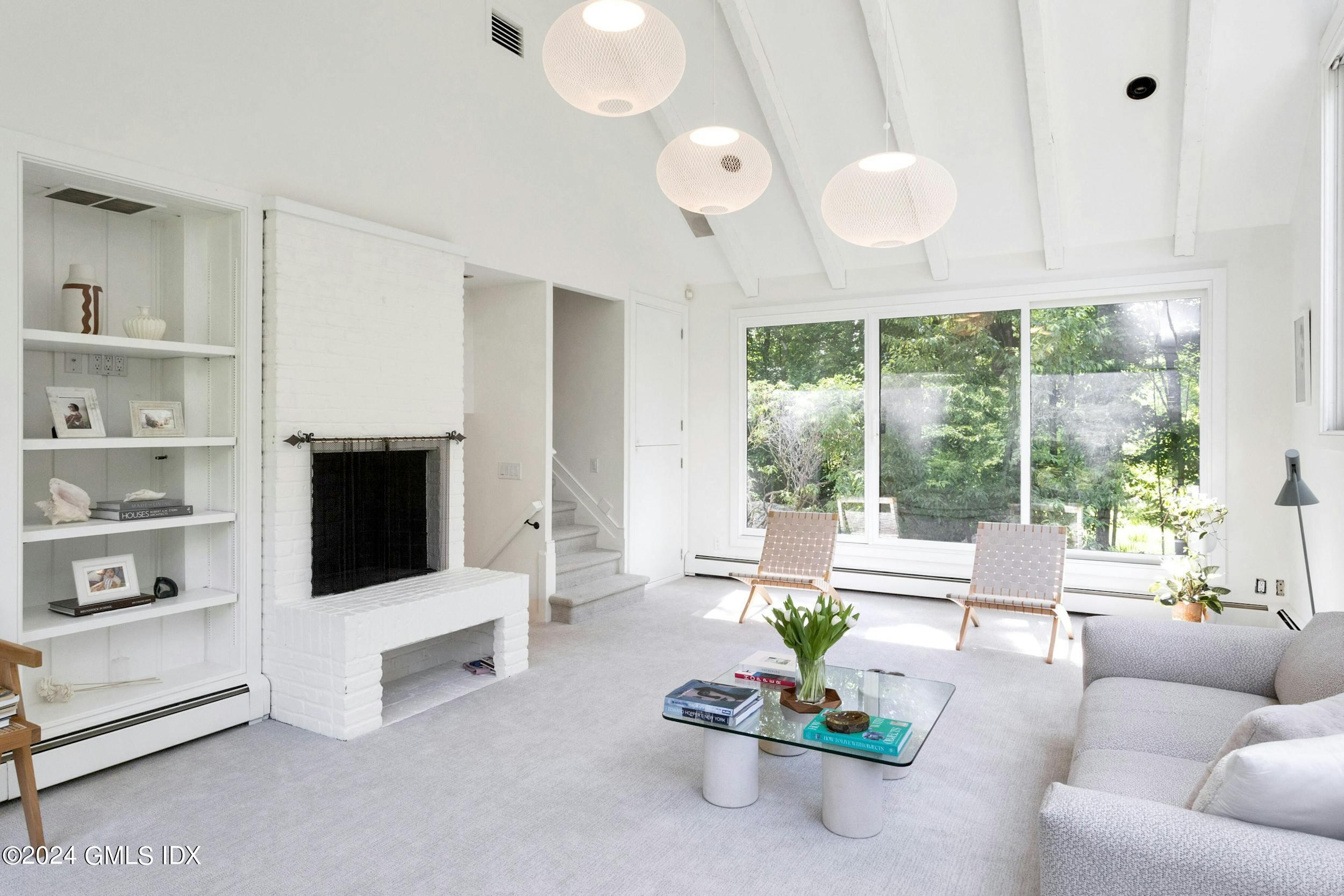 12 Guinea Road Greenwich, CT 06830 - Photo 19 of 38 a living room with furniture cabinets and a flat screen tv