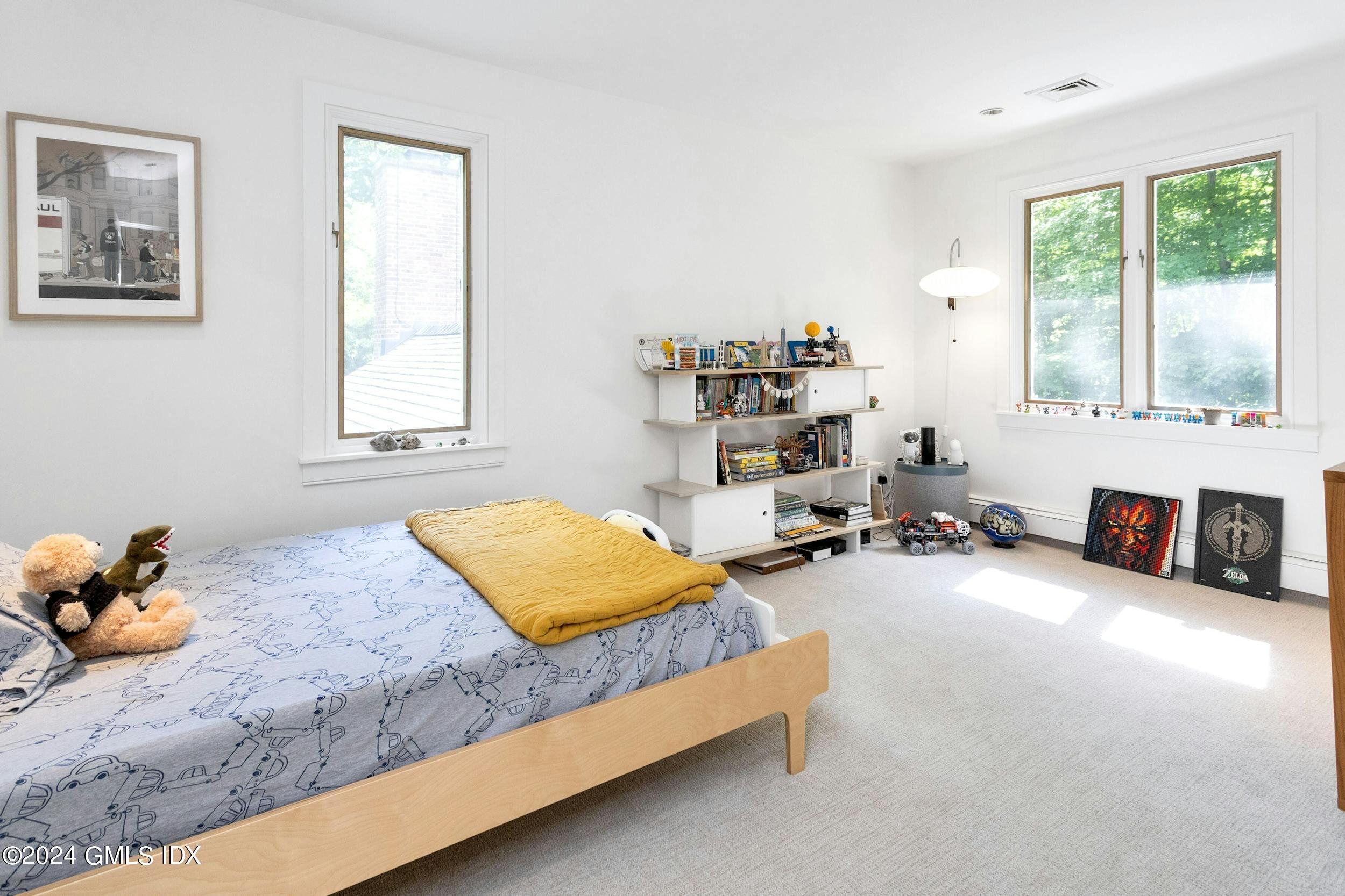 12 Guinea Road Greenwich, CT 06830 - Photo 20 of 38 a bedroom with furniture and a window