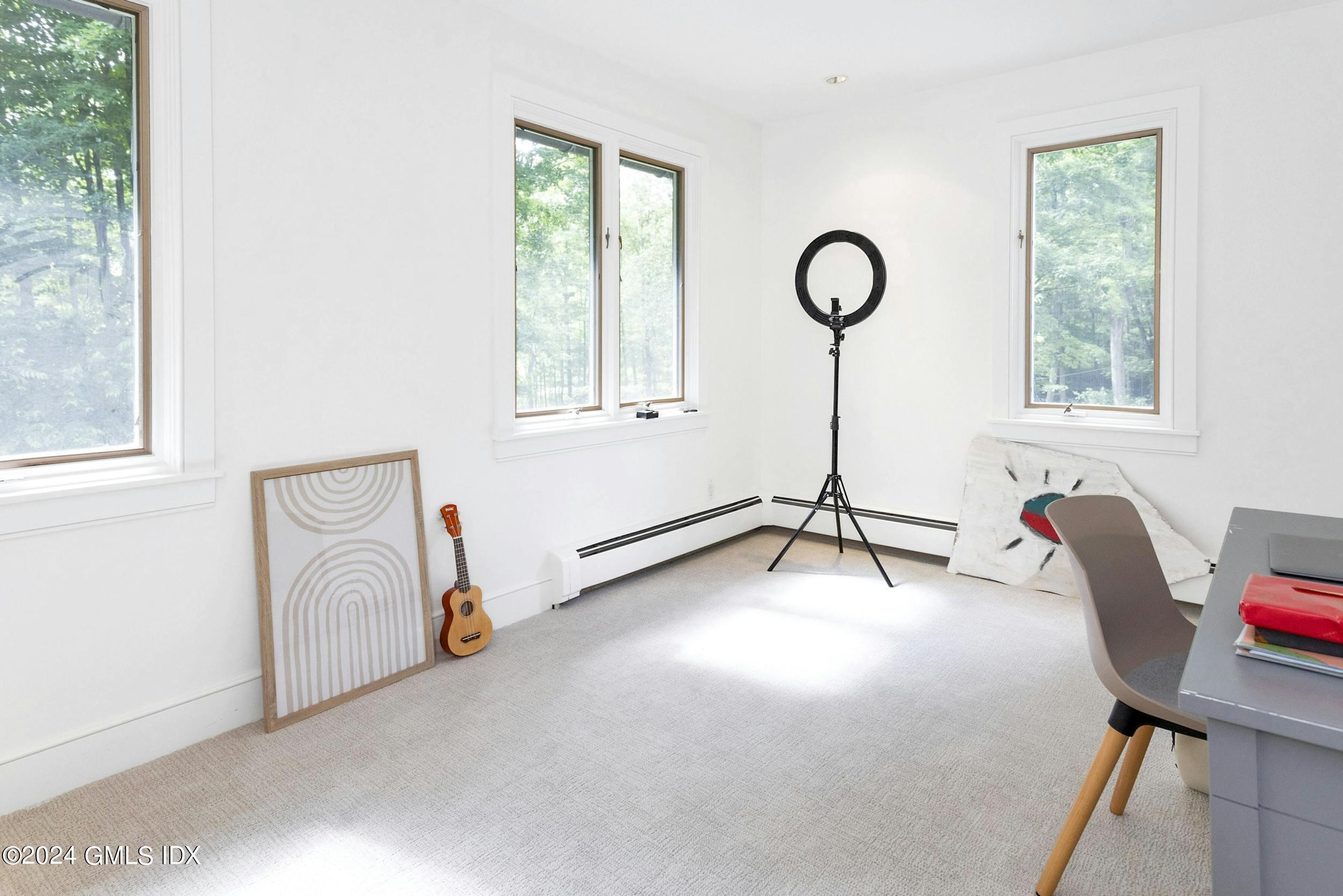 12 Guinea Road Greenwich, CT 06830 - Photo 22 of 38 a view of a livingroom with furniture and a window