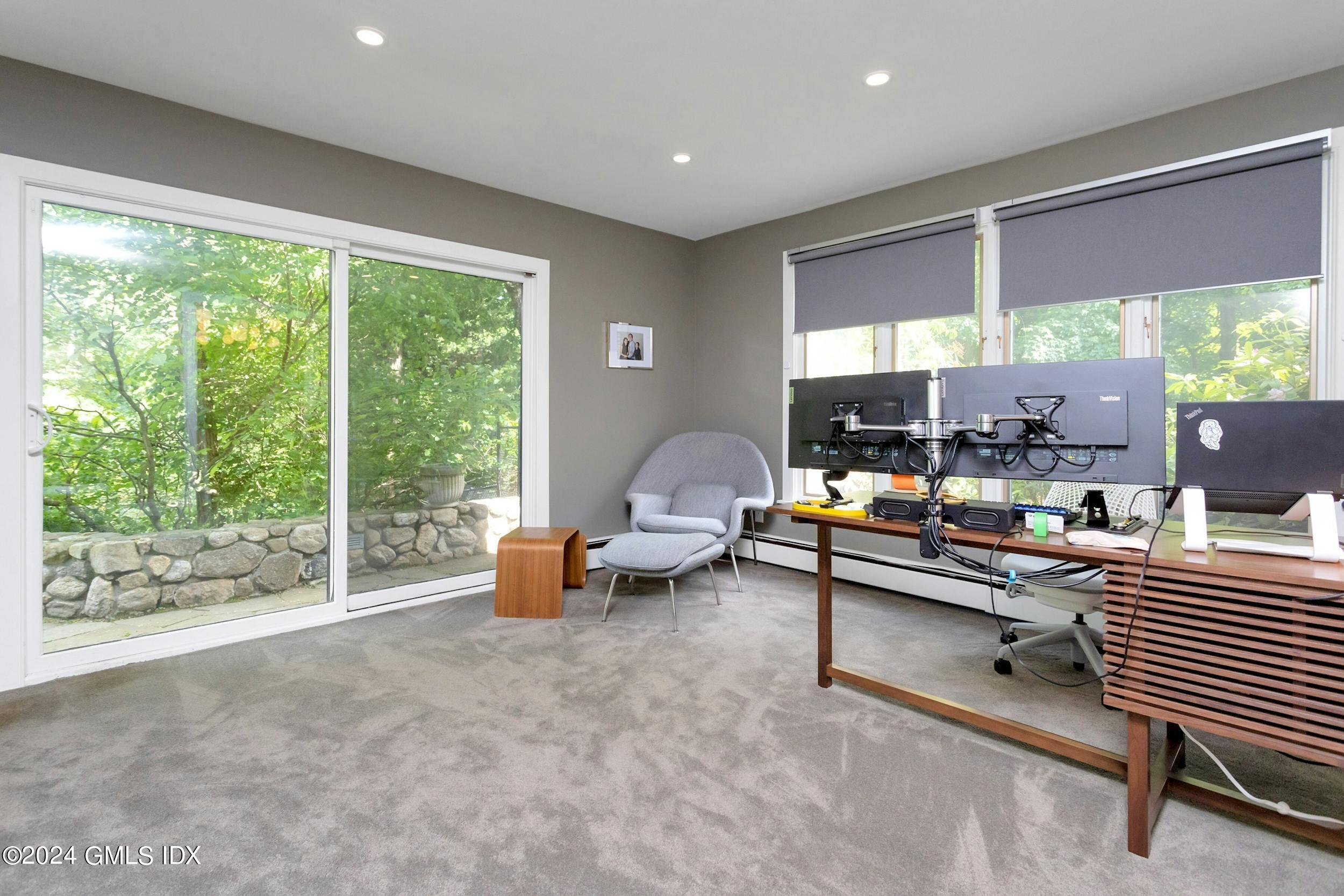 12 Guinea Road Greenwich, CT 06830 - Photo 7 of 38 a living room with furniture and a large window