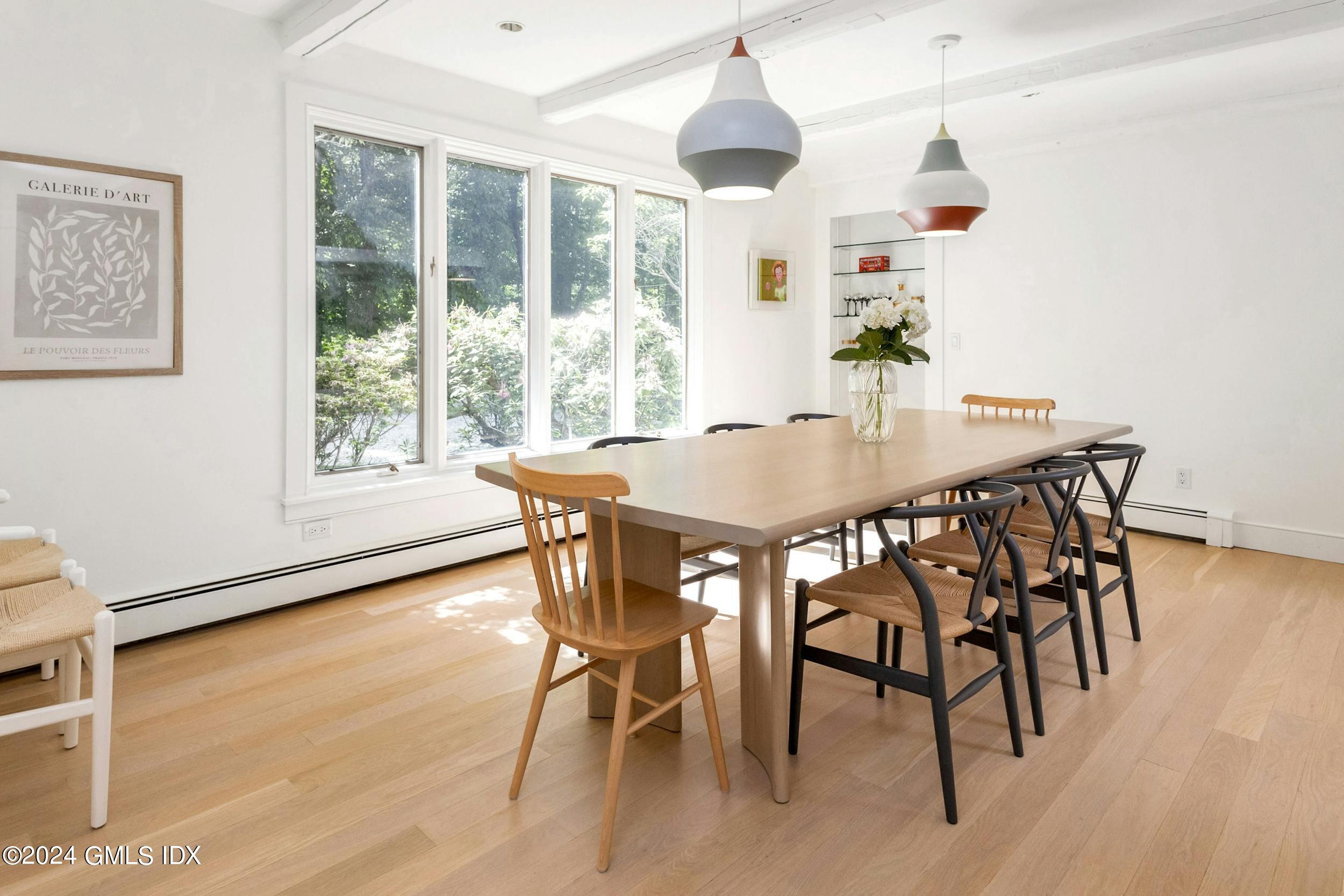 12 Guinea Road Greenwich, CT 06830 - Photo 8 of 38 a view of a dining room with furniture window and wooden floor