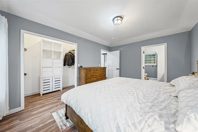 a bed room with a bed and a view of bedroom