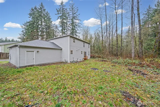 a house view with a backyard space