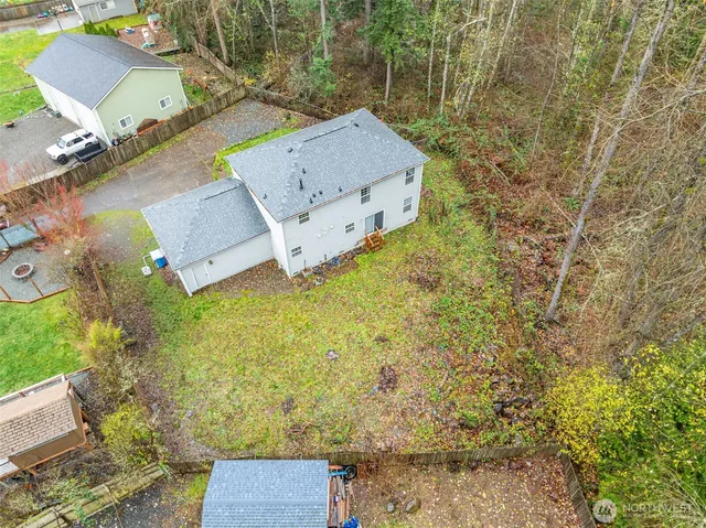 an aerial view of residential house with outdoor space