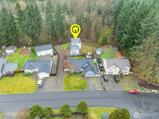 an aerial view of a house with a swimming pool