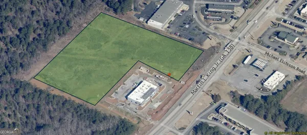 a view of a big yard with sitting area