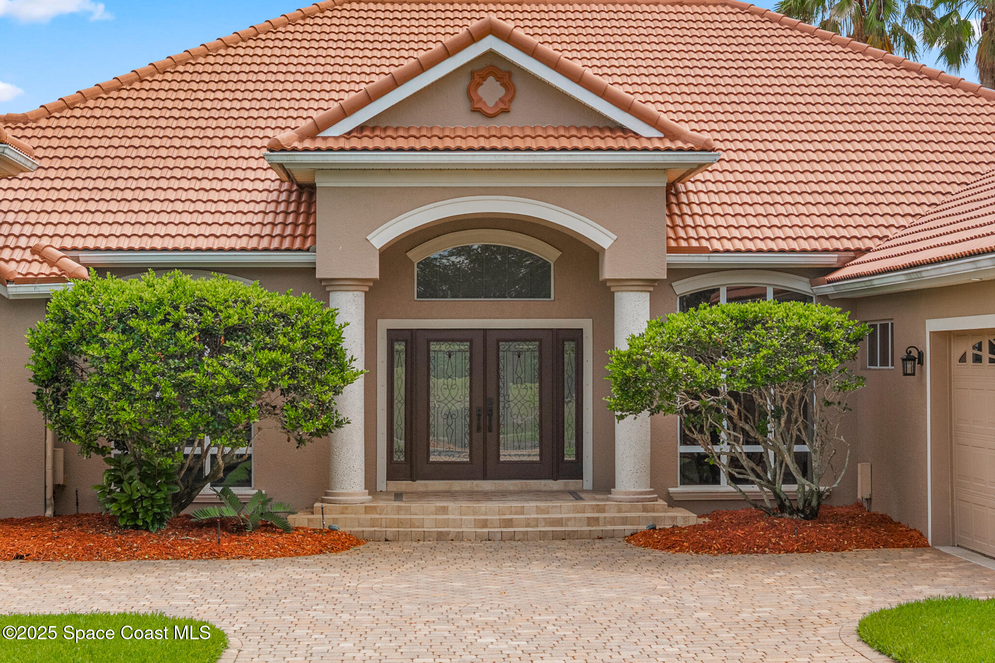 425 Baytree Drive Melbourne, FL 32940 - Photo 2 of 53 a front view of a house with garden