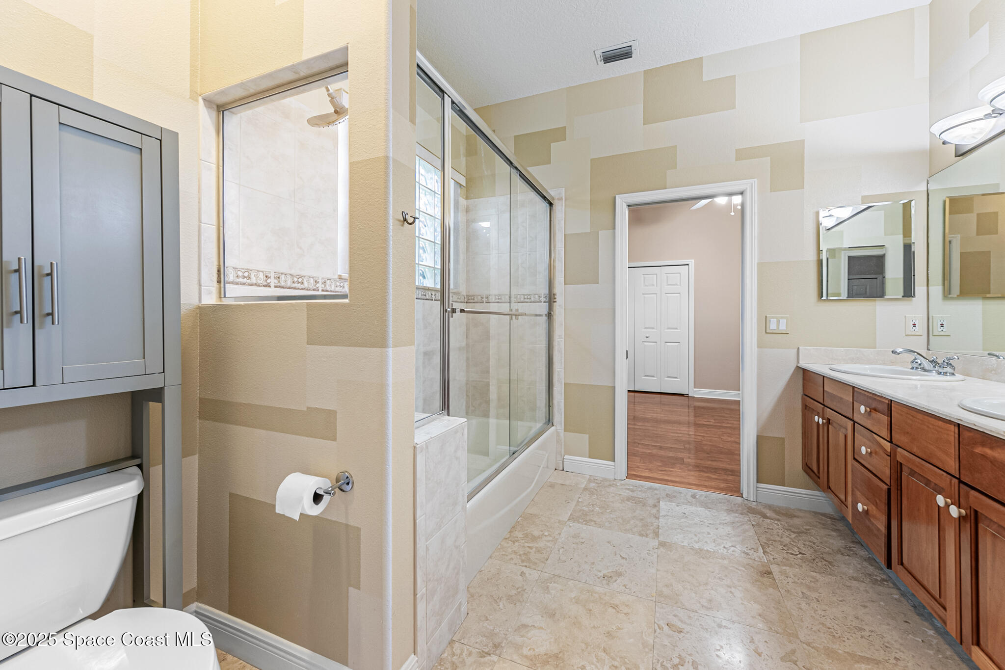 425 Baytree Drive Melbourne, FL 32940 - Photo 26 of 53 a bathroom with a granite countertop sink toilet and shower