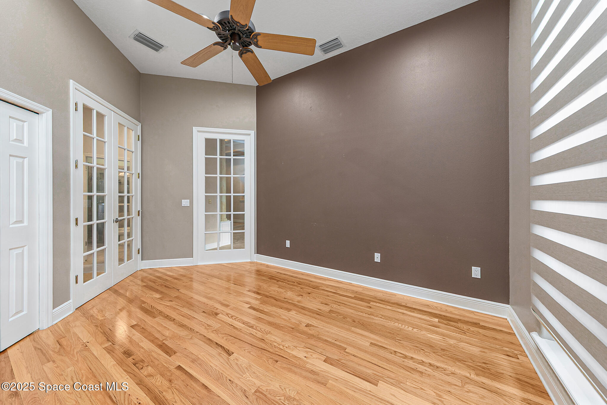 425 Baytree Drive Melbourne, FL 32940 - Photo 28 of 53 a view of a livingroom with a ceiling fan and window