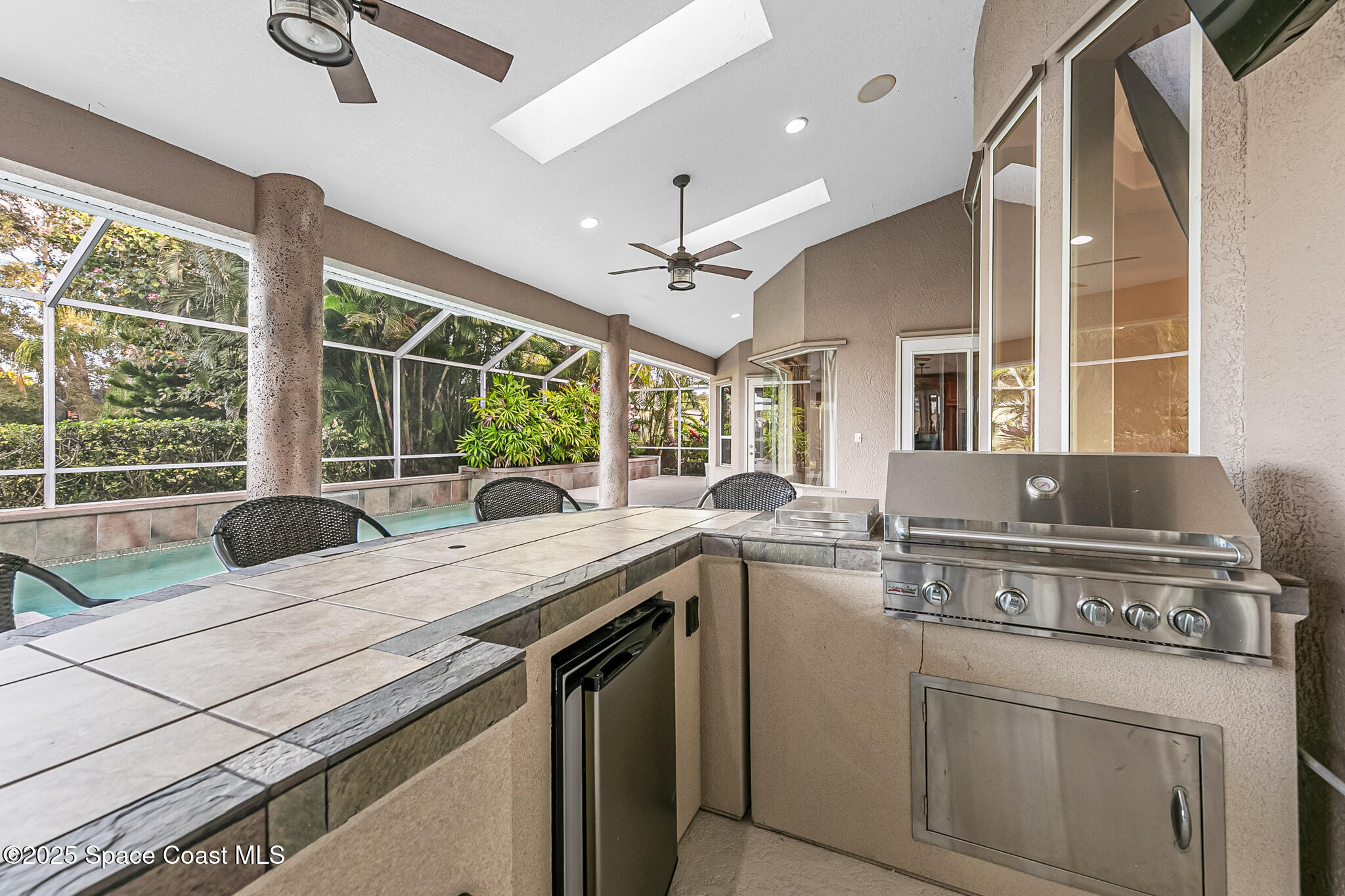 425 Baytree Drive Melbourne, FL 32940 - Photo 30 of 53 a view of a kitchen with a sink and a large window