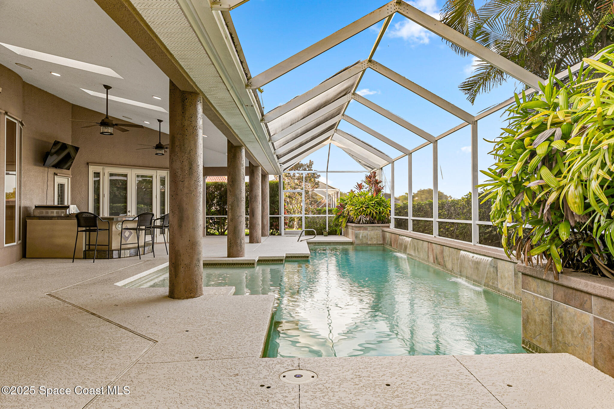 425 Baytree Drive Melbourne, FL 32940 - Photo 33 of 53 a view of a swimming pool with outdoor seating