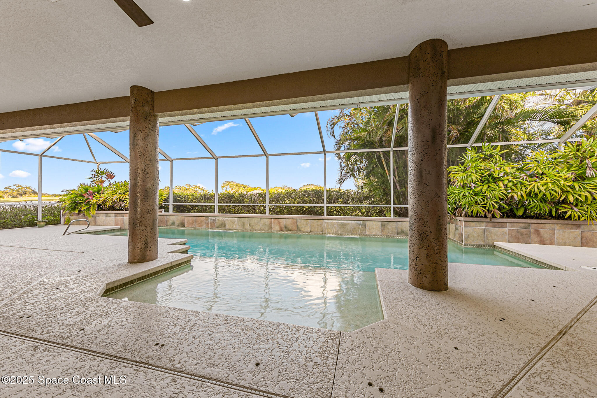 425 Baytree Drive Melbourne, FL 32940 - Photo 34 of 53 a view of swimming pool with a floor to ceiling windows and a room