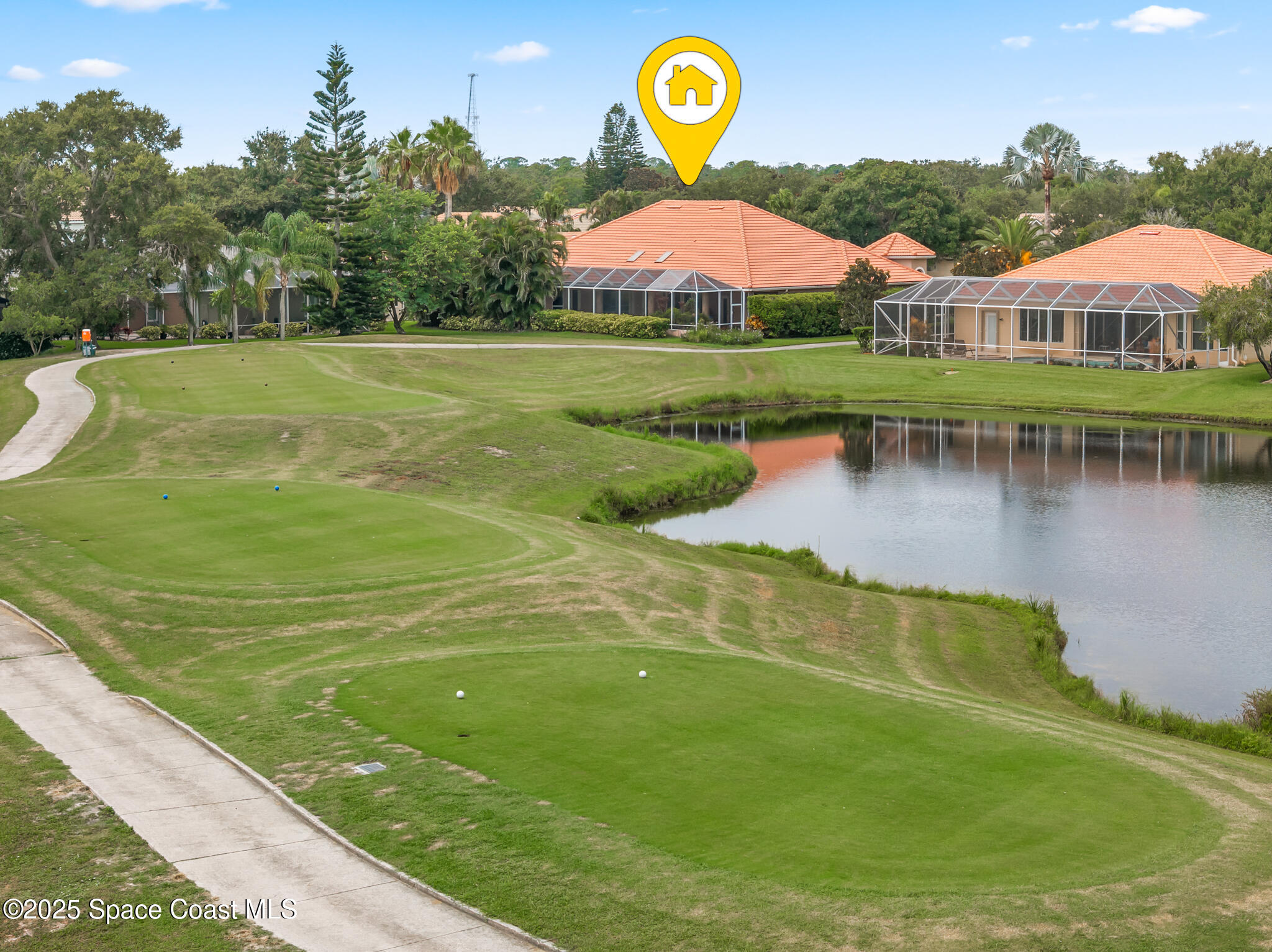 425 Baytree Drive Melbourne, FL 32940 - Photo 51 of 53 a view of a swimming pool with a table and chairs
