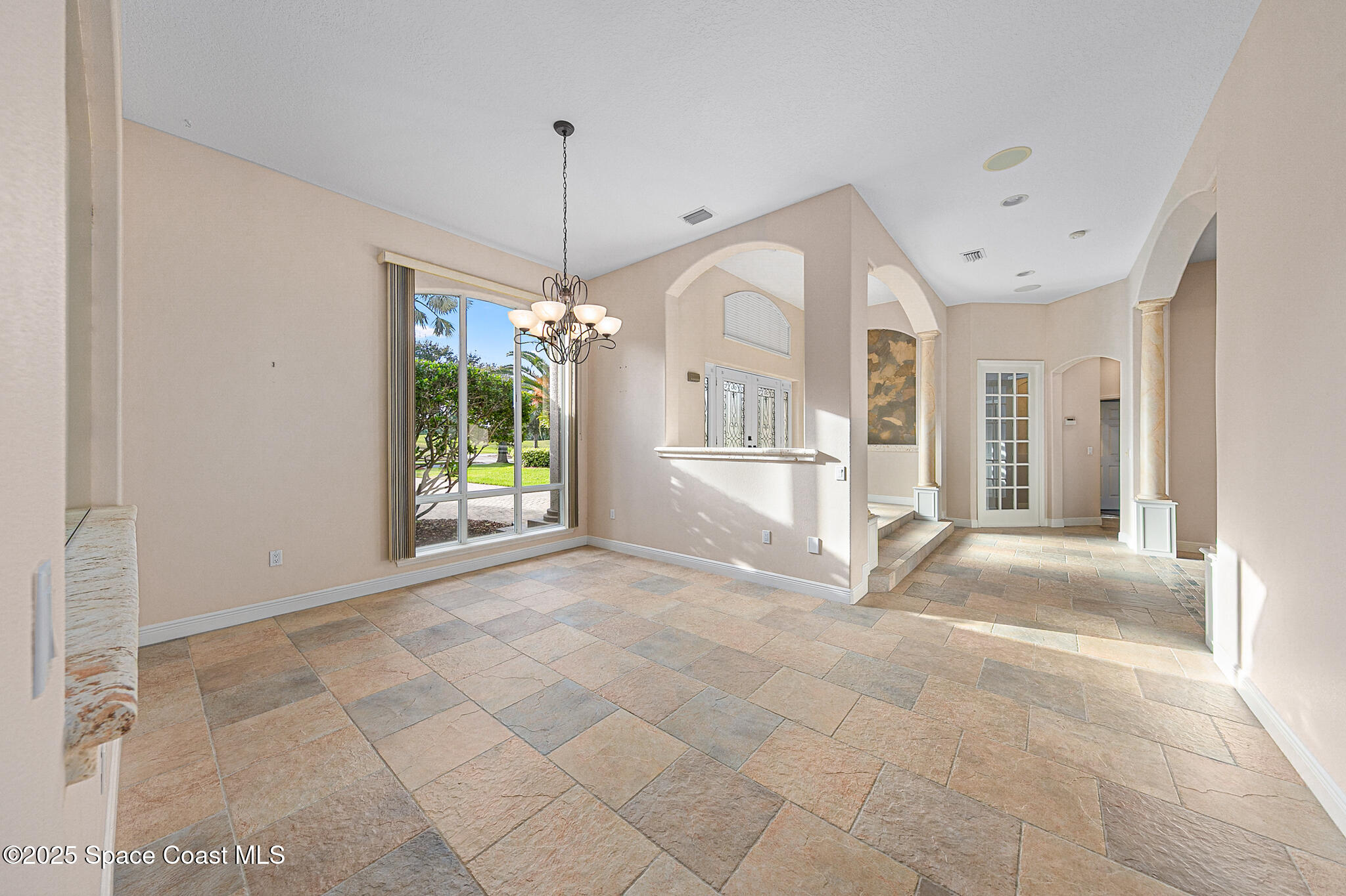 425 Baytree Drive Melbourne, FL 32940 - Photo 8 of 53 a view of entryway and chandelier
