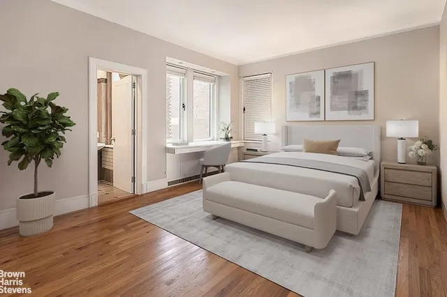 a bedroom with a bed and a chair