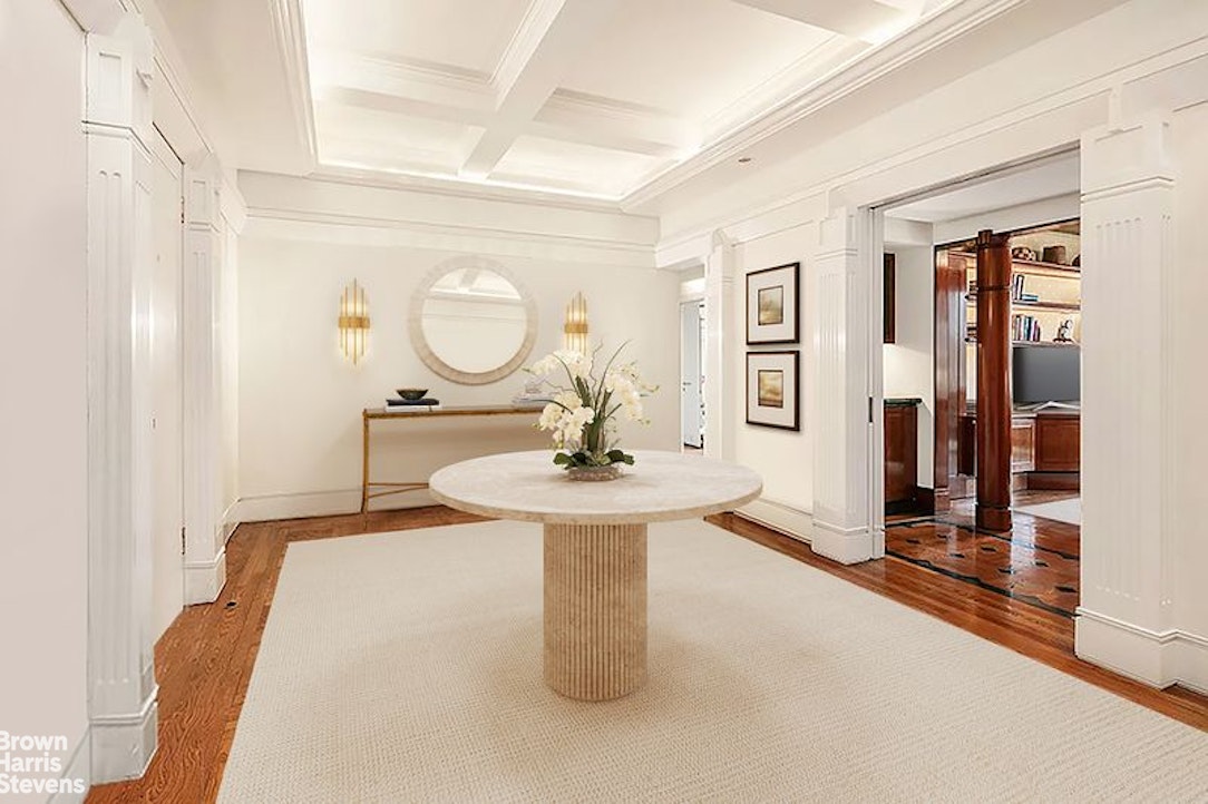 1133 5th Avenue, Unit 7A Manhattan, NY 10128 - Photo 4 of 12 a living room with fireplace furniture and a table