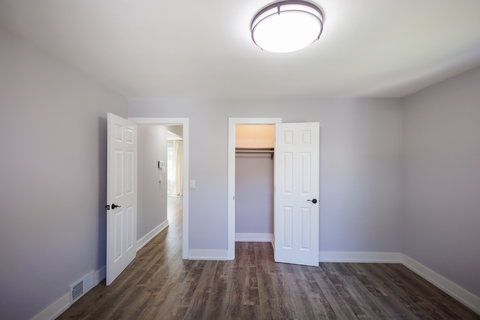 855 East 5000S Road Kankakee, IL 60901 - Photo 19 of 48 an empty room with wooden floor and windows