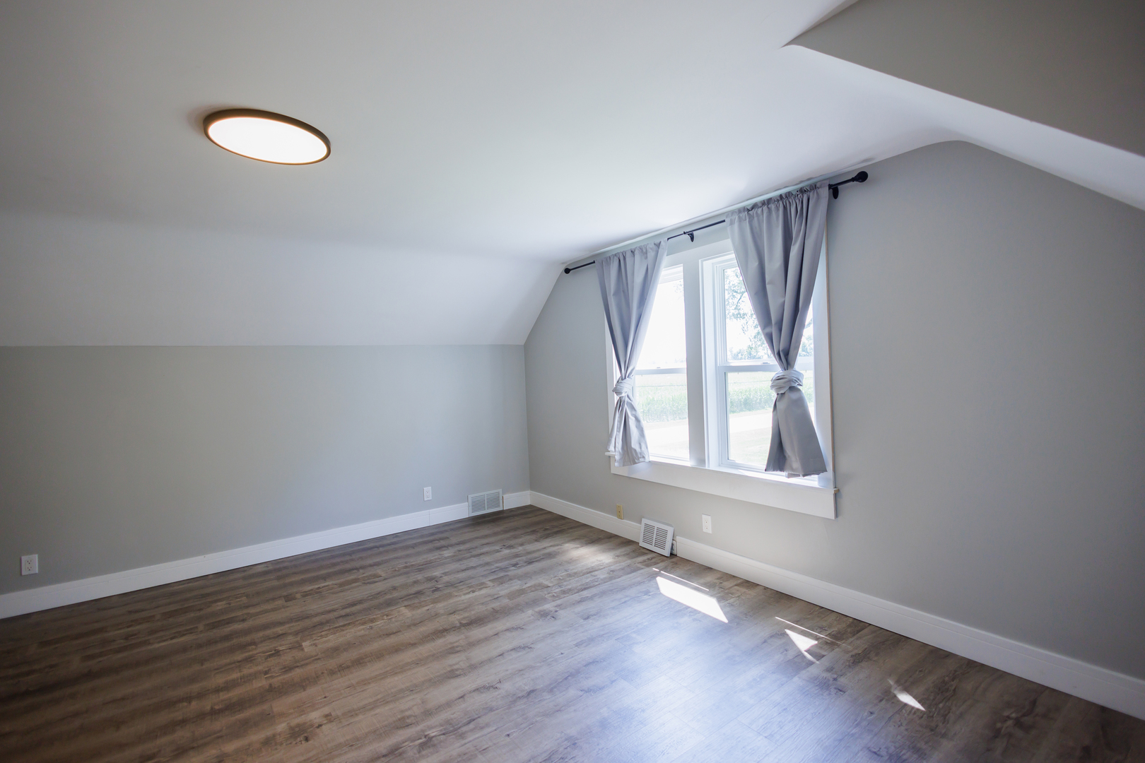 855 East 5000S Road Kankakee, IL 60901 - Photo 25 of 48 an empty room with wooden floor and windows