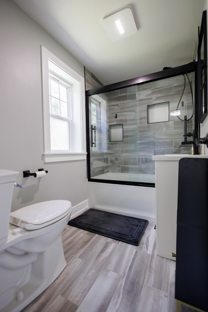 855 East 5000S Road Kankakee, IL 60901 - Photo 26 of 48 a bathroom with a toilet sink and mirror