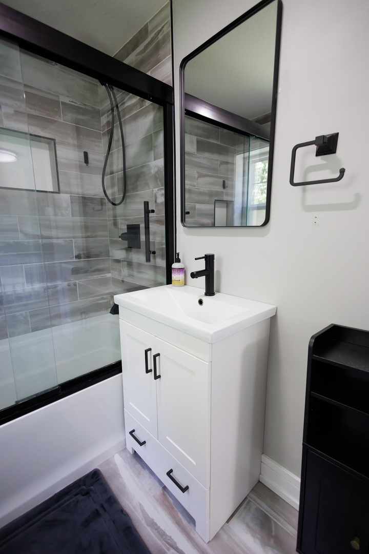 855 East 5000S Road Kankakee, IL 60901 - Photo 28 of 48 a bathroom with a sink and a mirror