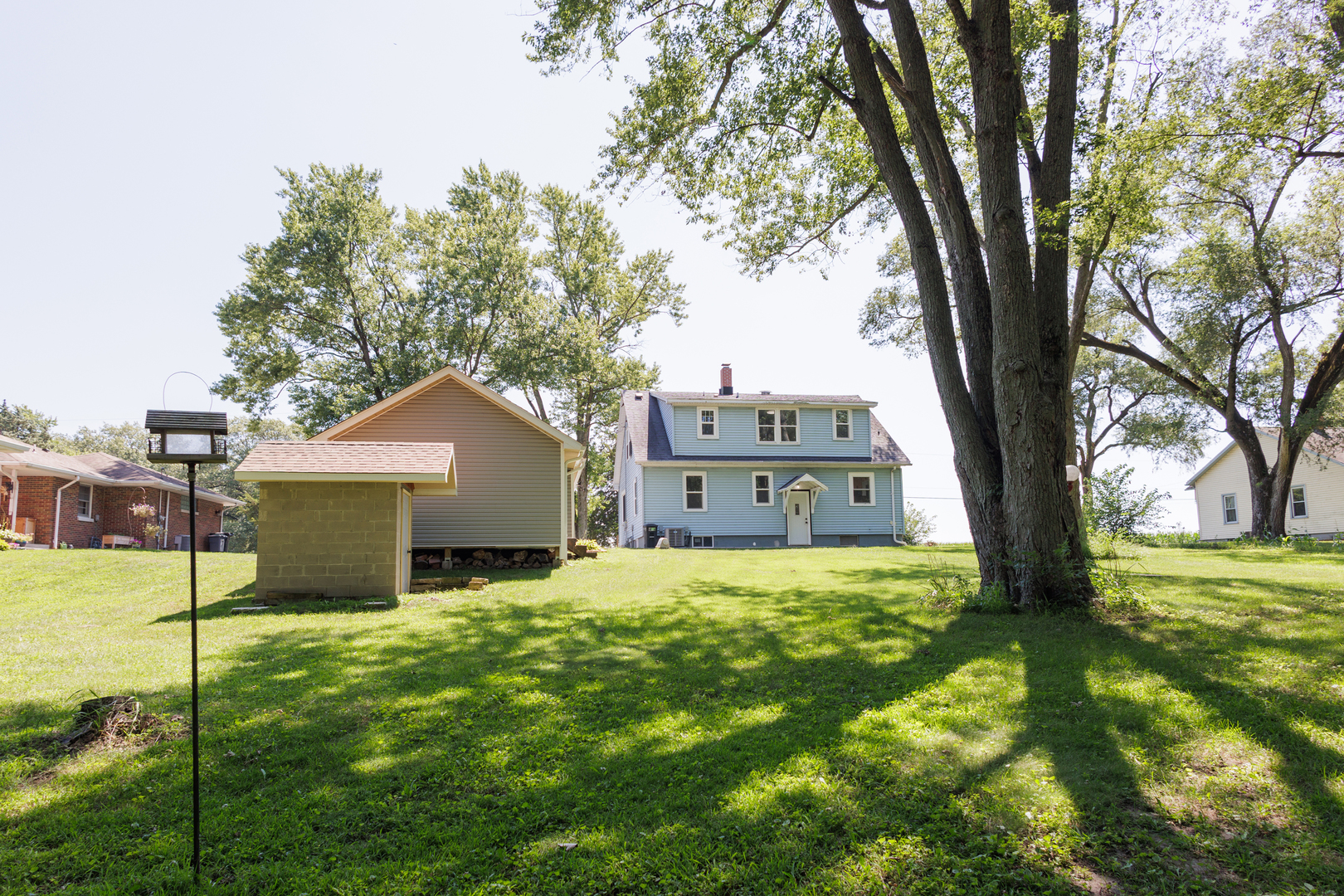 855 East 5000S Road Kankakee, IL 60901 - Photo 44 of 48 a large house with a big yard and large trees