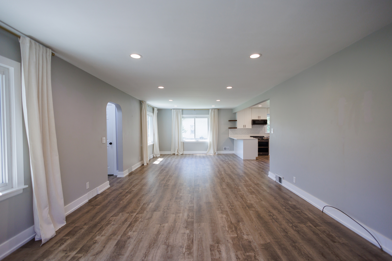 855 East 5000S Road Kankakee, IL 60901 - Photo 7 of 48 a view of empty room with wooden floor and kitchen