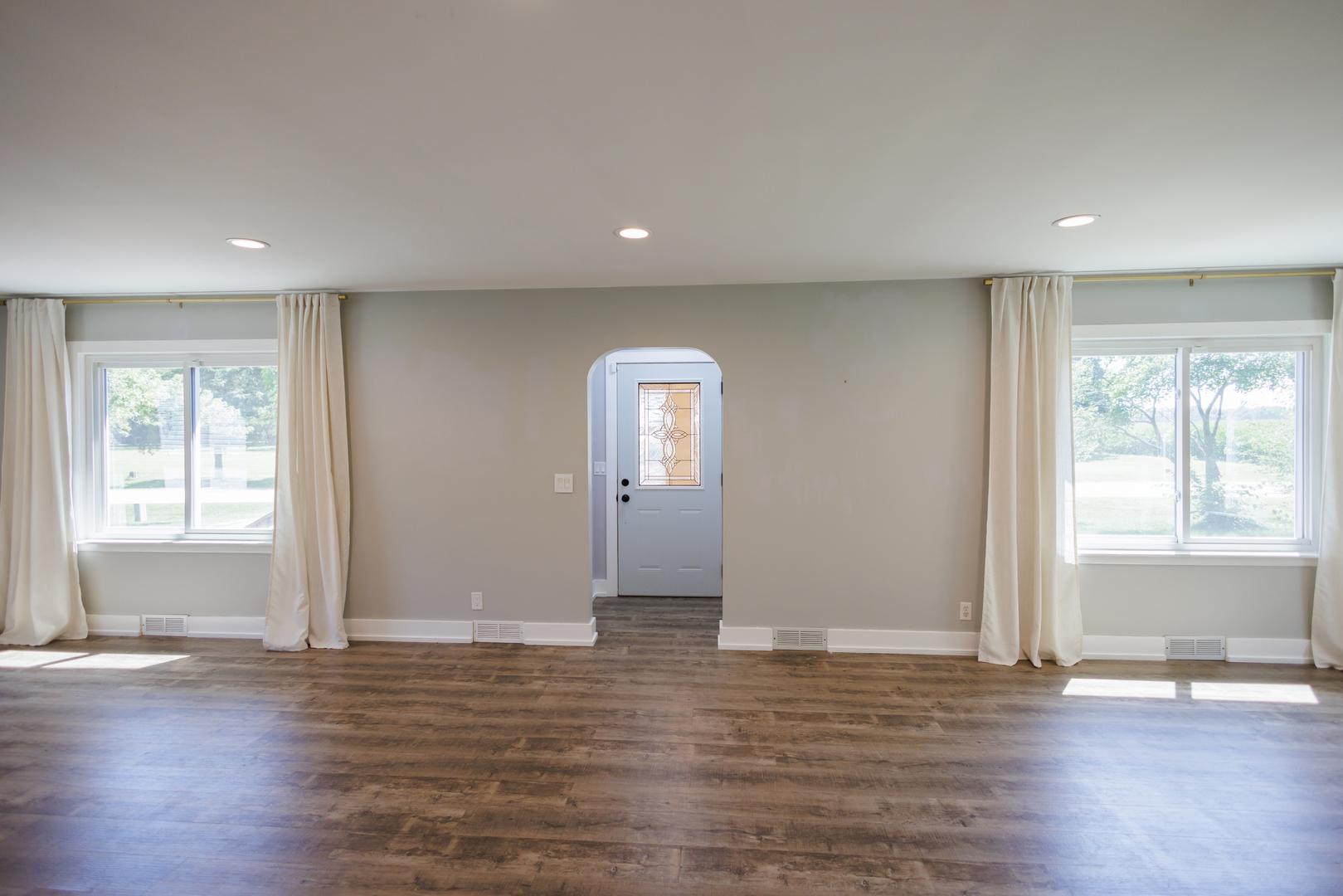 855 East 5000S Road Kankakee, IL 60901 - Photo 8 of 48 an empty room with wooden floor and windows