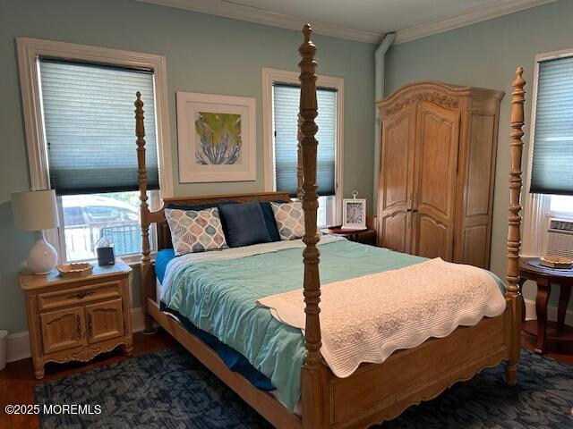 84 Mt Zion Way, Unit 1 Ocean Grove, NJ 07756 - Photo 12 of 16 a bedroom with a bed and flat tv screen on dresser