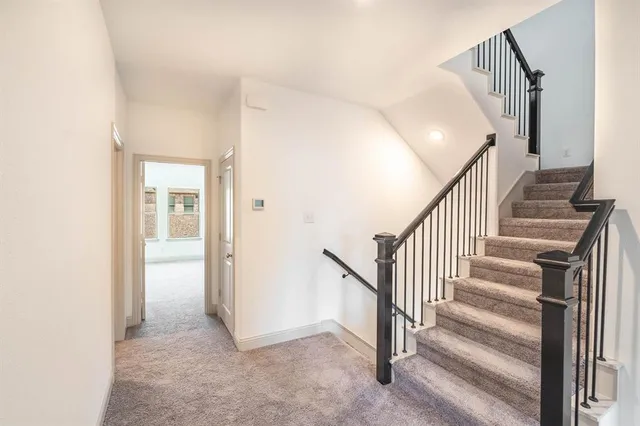 a view of a hallway with staircase
