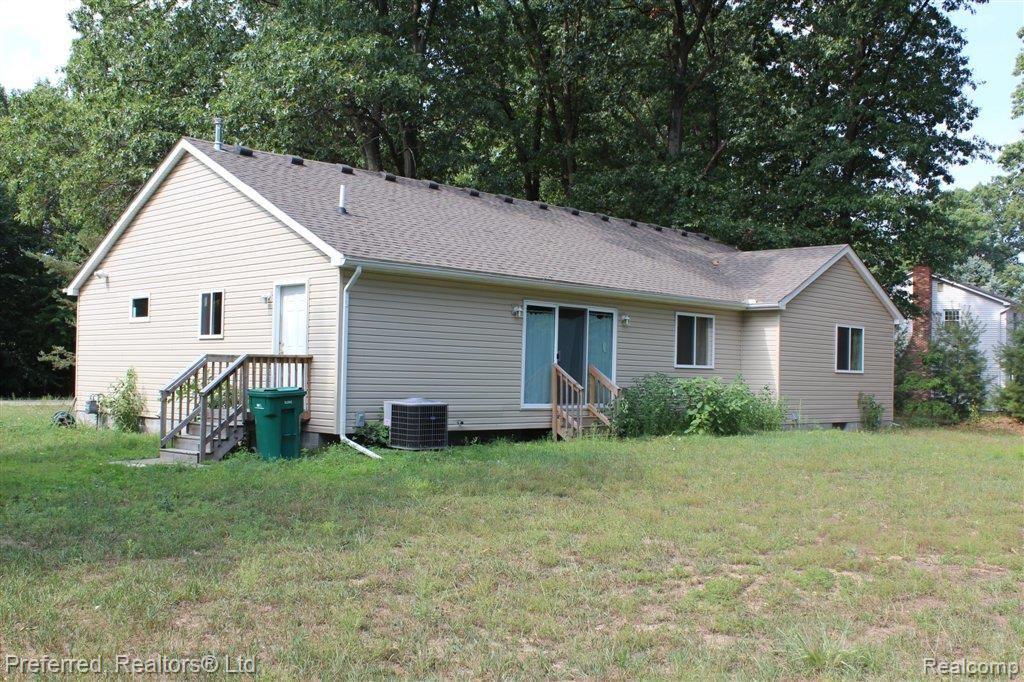 41780 Bemis Road Belleville, MI 48111 - Photo 8 of 10 REAR VIEW OF HOME