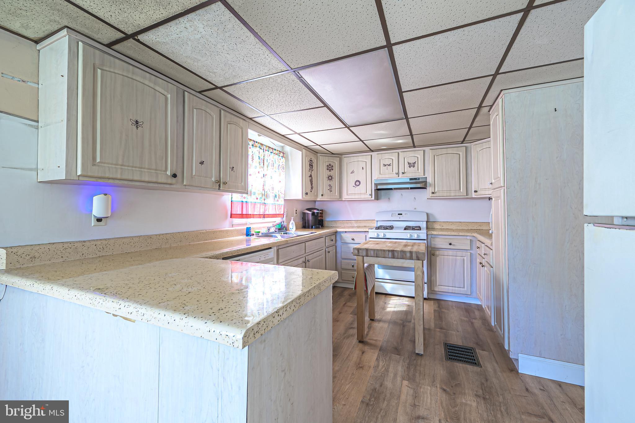 311 Woodruff Carmel Road Bridgeton, NJ 08302 - Photo 13 of 40 a kitchen with stainless steel appliances granite countertop a sink window and cabinets