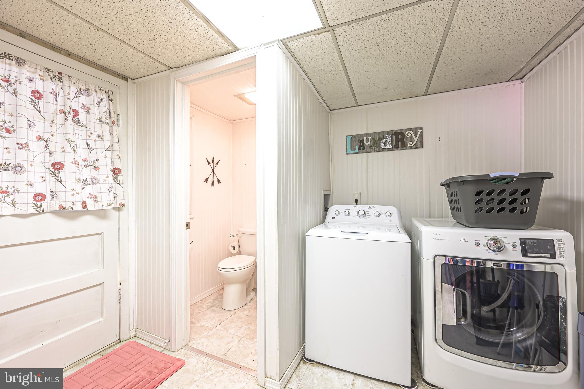 311 Woodruff Carmel Road Bridgeton, NJ 08302 - Photo 16 of 40 a utility room with dryer and washer