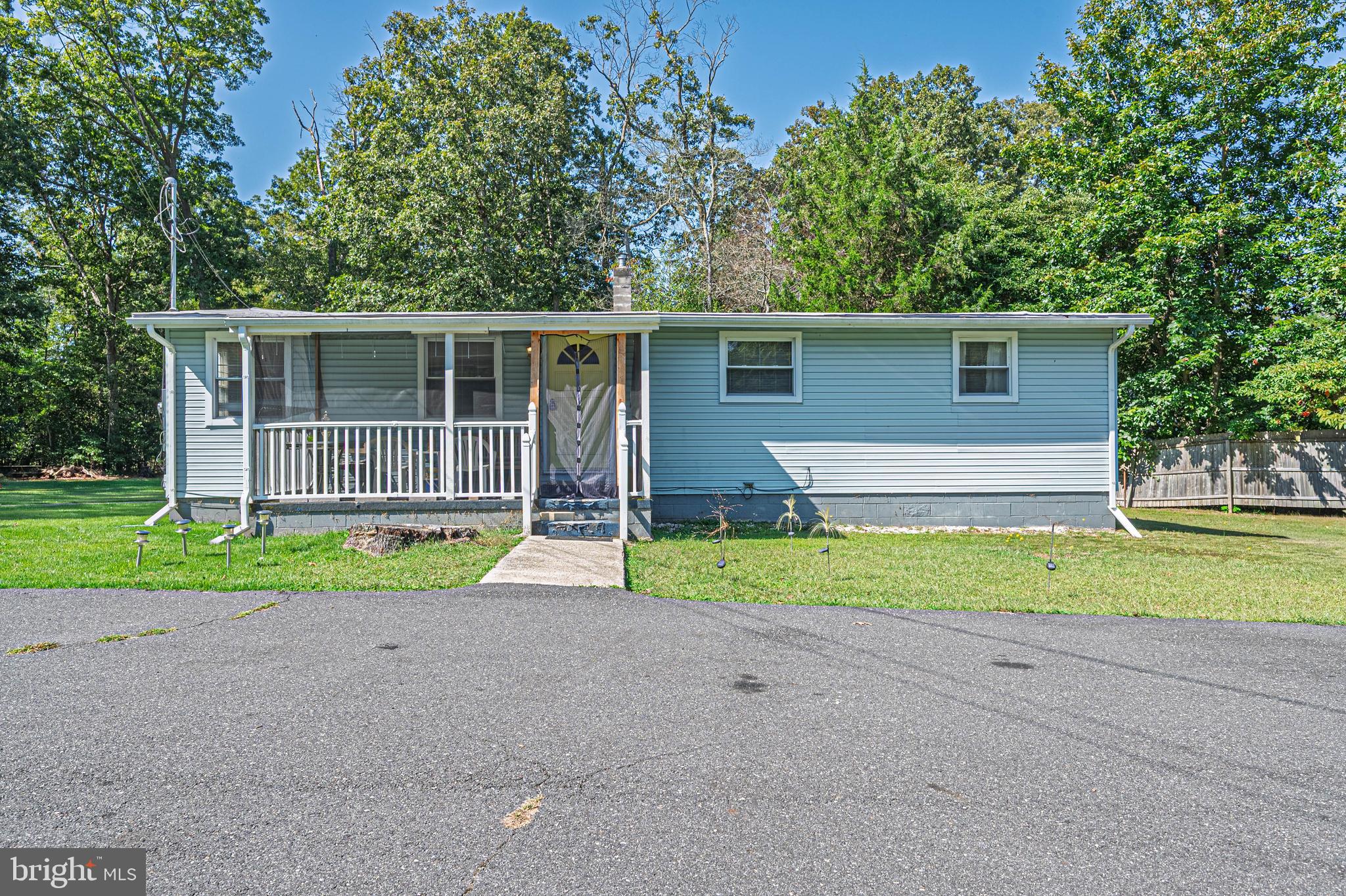 311 Woodruff Carmel Road Bridgeton, NJ 08302 - Photo 2 of 40 a house with a yard and a large space