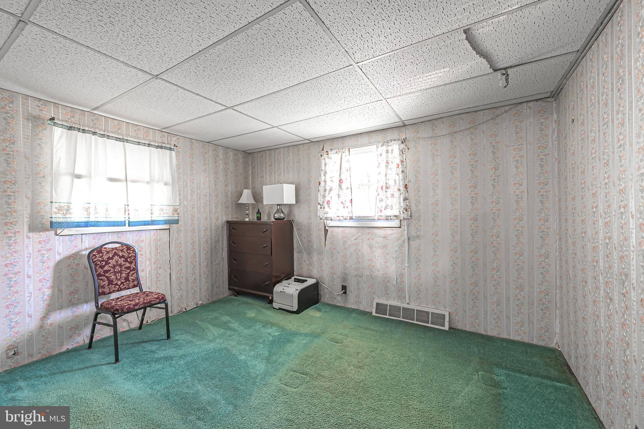 311 Woodruff Carmel Road Bridgeton, NJ 08302 - Photo 21 of 40 a living room with furniture and a window