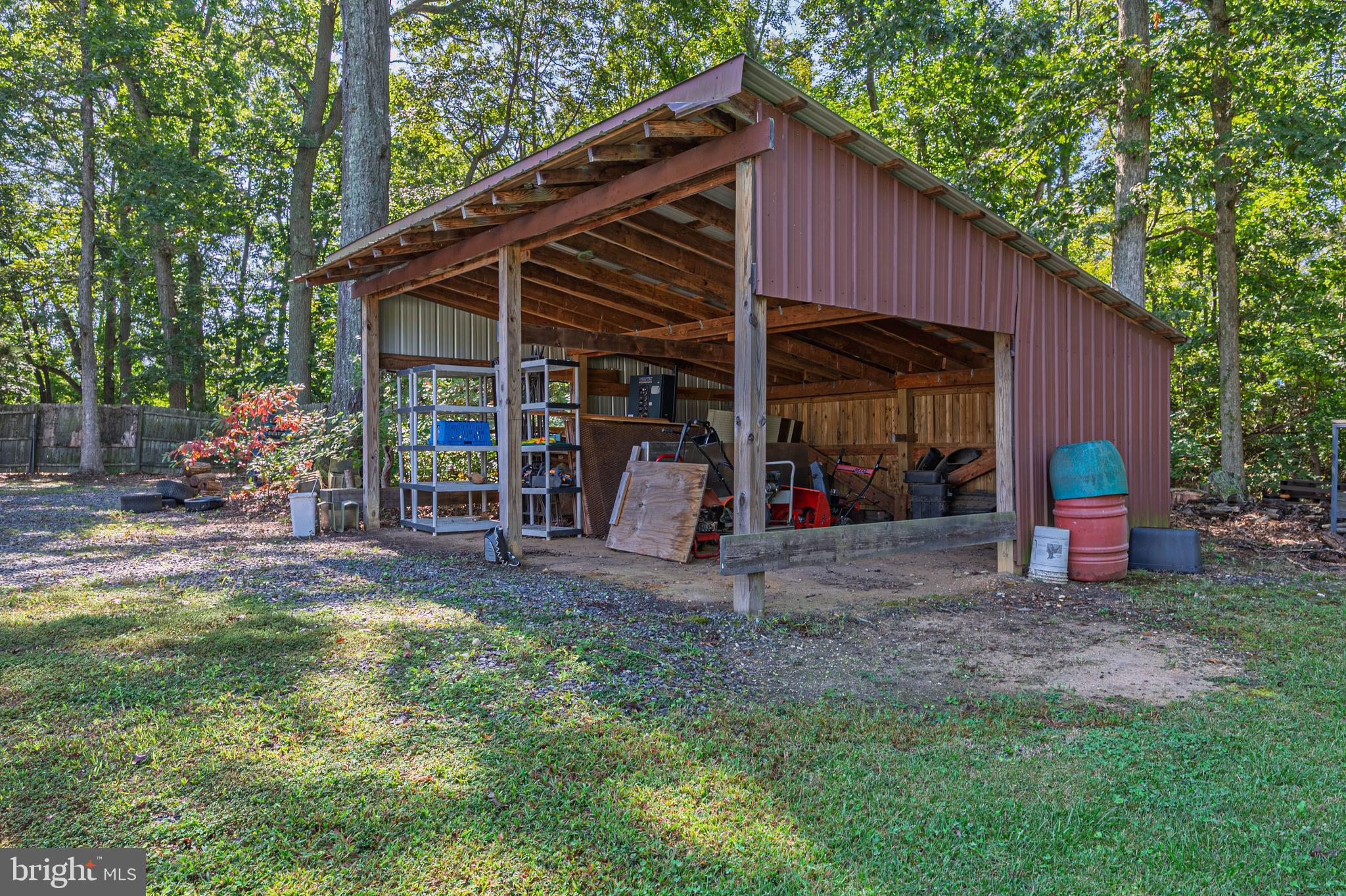 311 Woodruff Carmel Road Bridgeton, NJ 08302 - Photo 27 of 40 a view of a wooden house with a yard and furniture