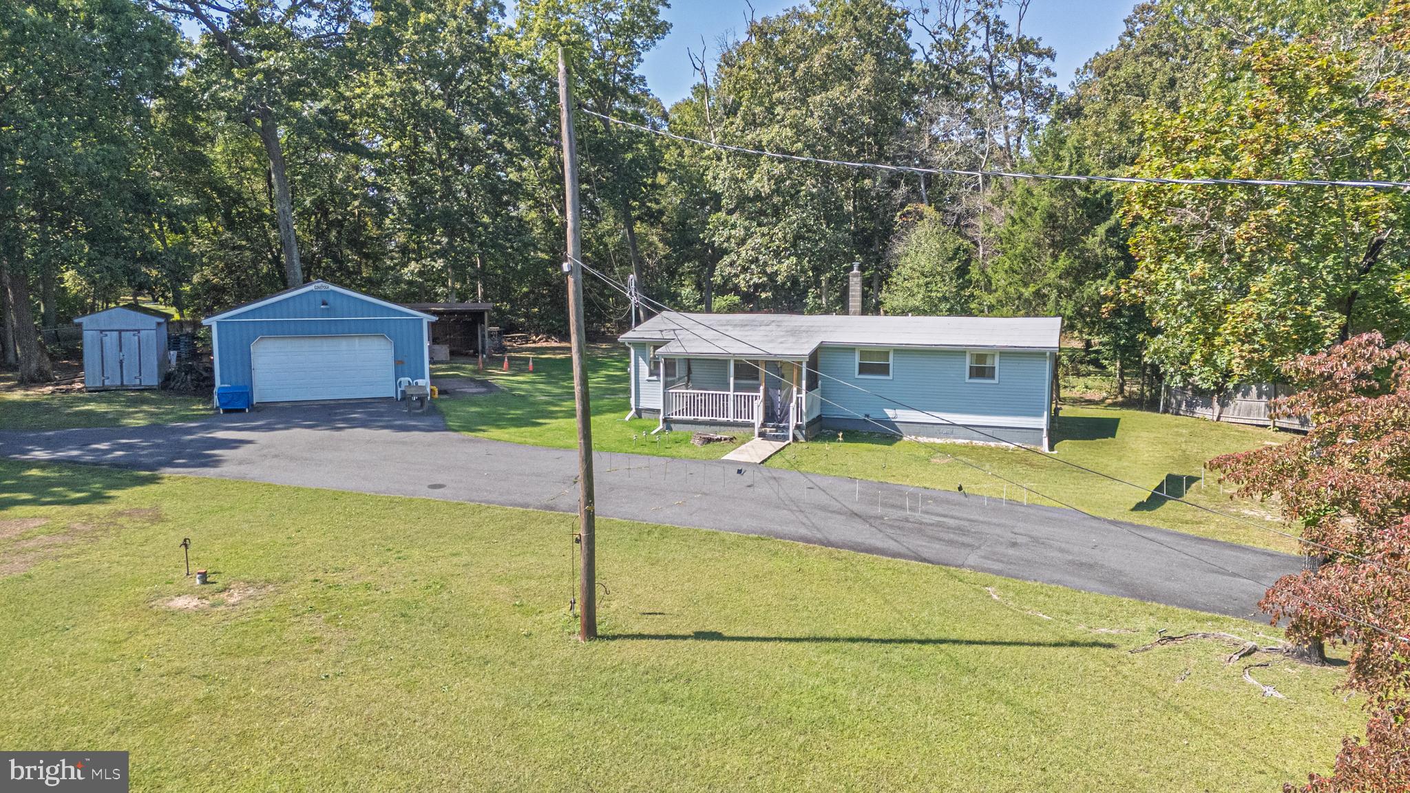 311 Woodruff Carmel Road Bridgeton, NJ 08302 - Photo 29 of 40 a view of a house with a swimming pool