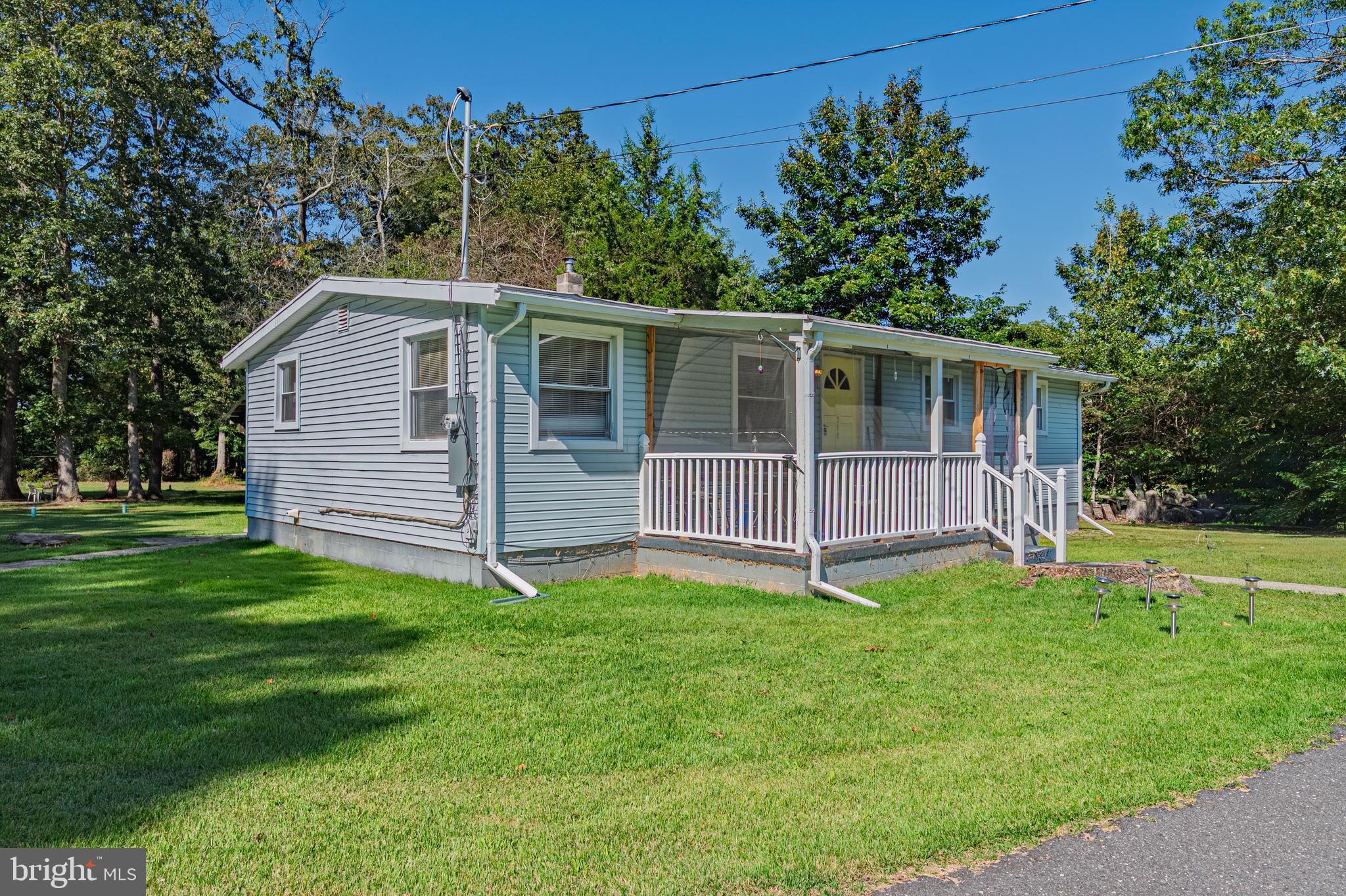 311 Woodruff Carmel Road Bridgeton, NJ 08302 - Photo 3 of 40 a view of a house with a yard and a garden