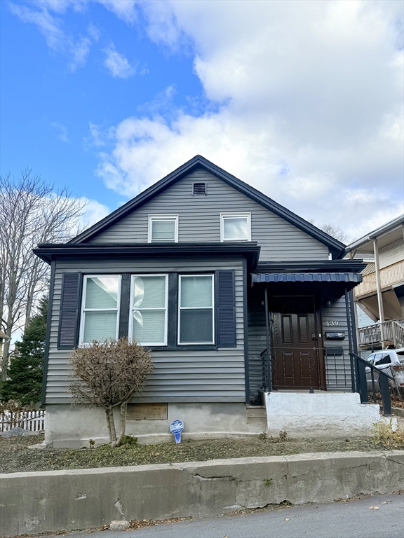 a front view of a house with garage