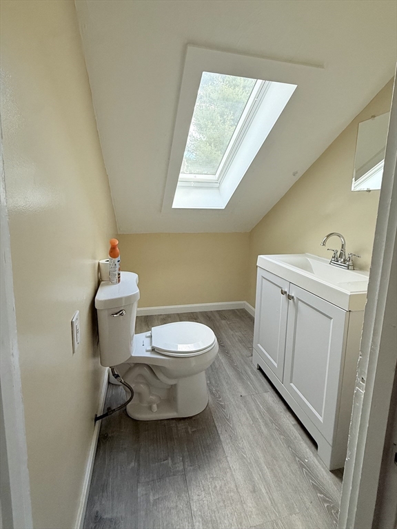 139 Endicott Street Worcester, MA 01610 - Photo 8 of 9 a white toilet sitting next to a bathroom sink