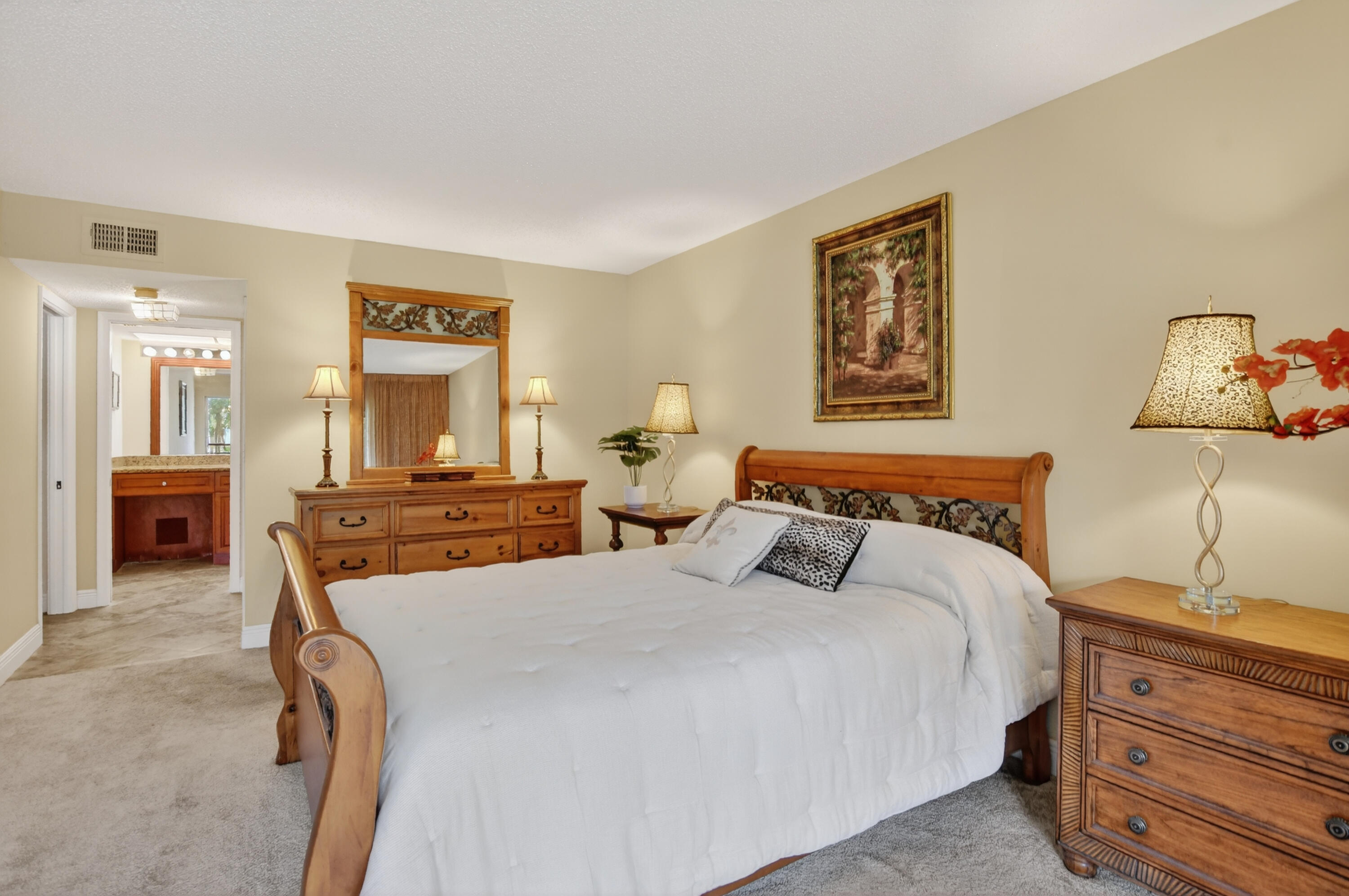 23345 Carolwood Lane, Unit 205 Boca Raton, FL 33428 - Photo 17 of 59 a bed room with two bed and a night stand